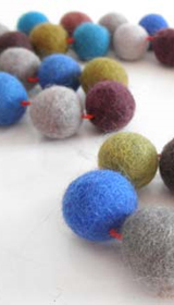 
wool felt balls, felt wool rugs, needle felting, pom poms, nepal, wholesale, felt pom, diy felt, nepal, fair trade, felted wool, round rugs, pom pom